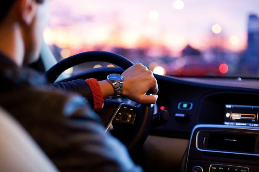 man driving new car