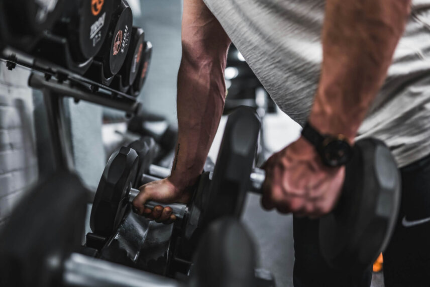 Man at gym weight training