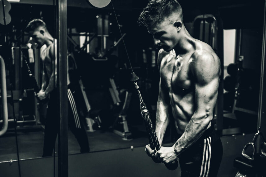 Man doing triceps pull downs