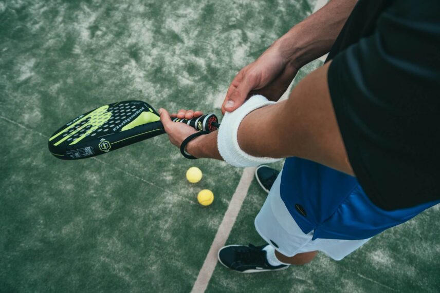 a man holding a padel racket