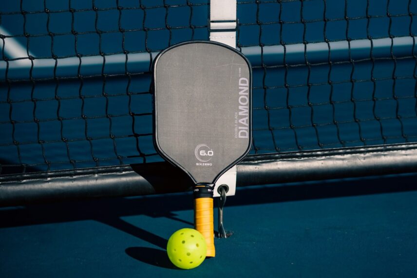 a pickleball and a paddle