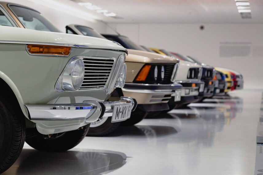Lineup of classic cars in a garage