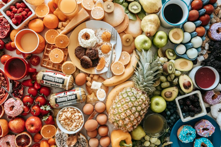 A diverse selection of fresh fruits and vegetables artfully arranged on a table, highlighting their natural beauty.