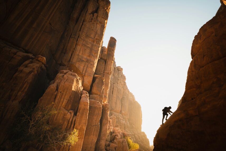 A man climbing a mountain.