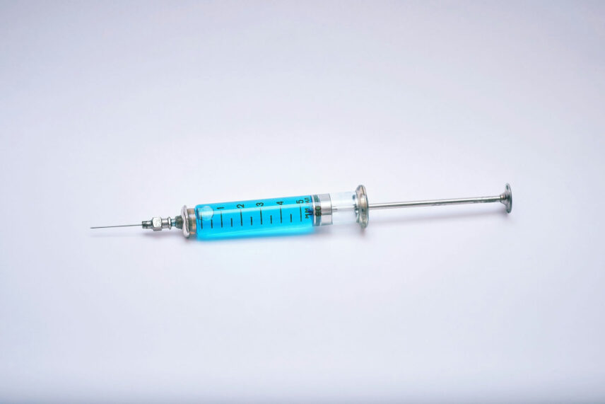 A medical needle filled with a blue substance