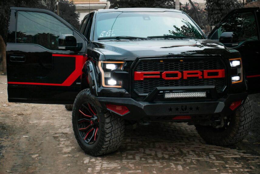 Ford F-150 Raptor pickup truck parked with a door open