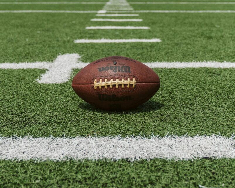 A football on the hash of a football field