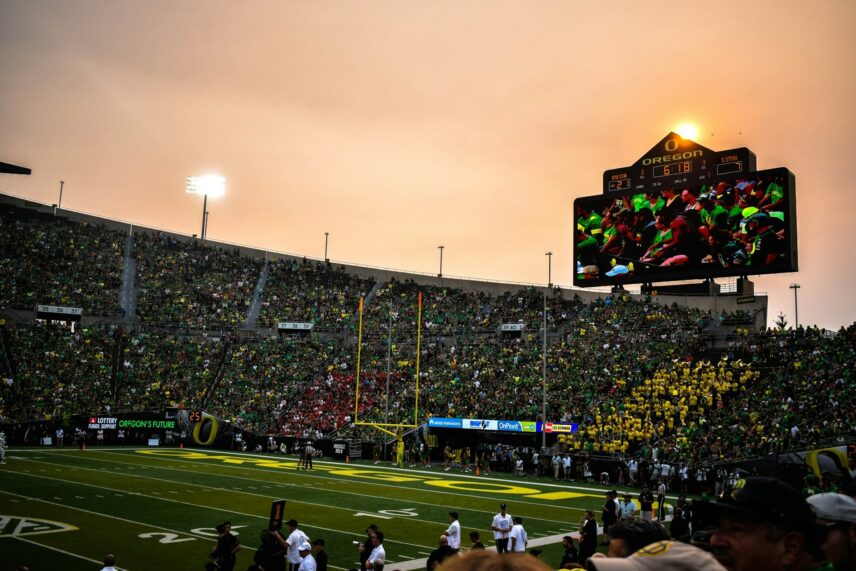 Oregon's football stadium end zone during game at sunset