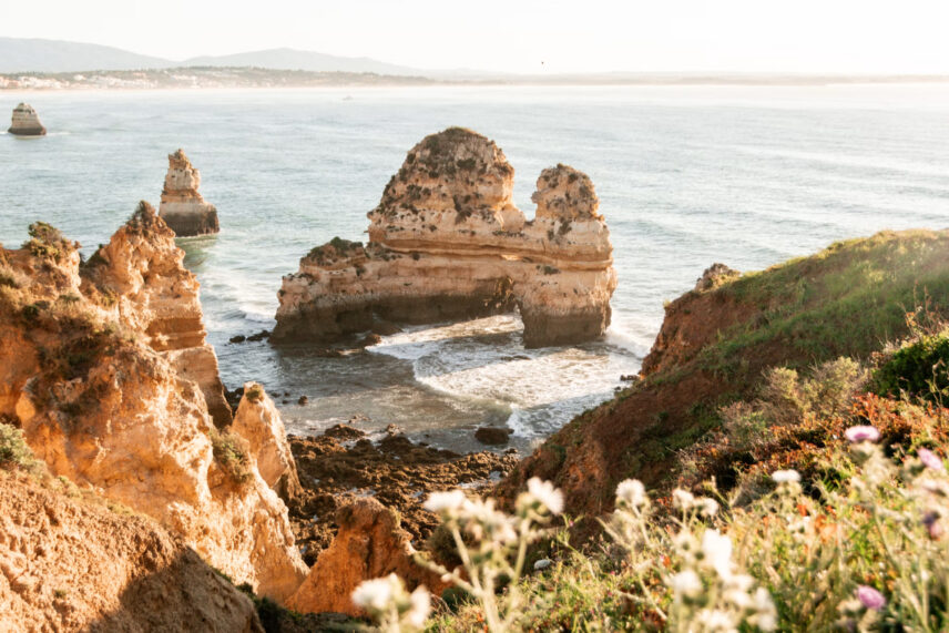jagged orange cliffs and rocks in sea