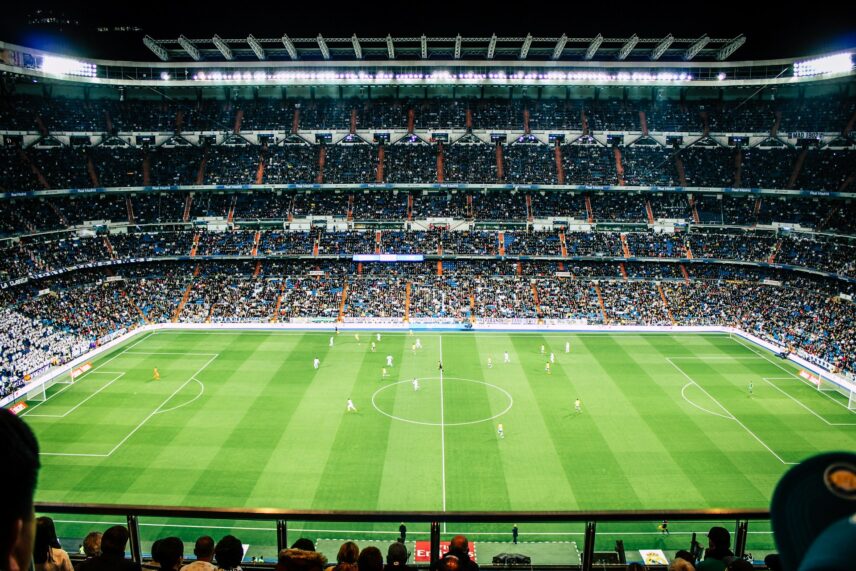 a soccer field within a large stadium