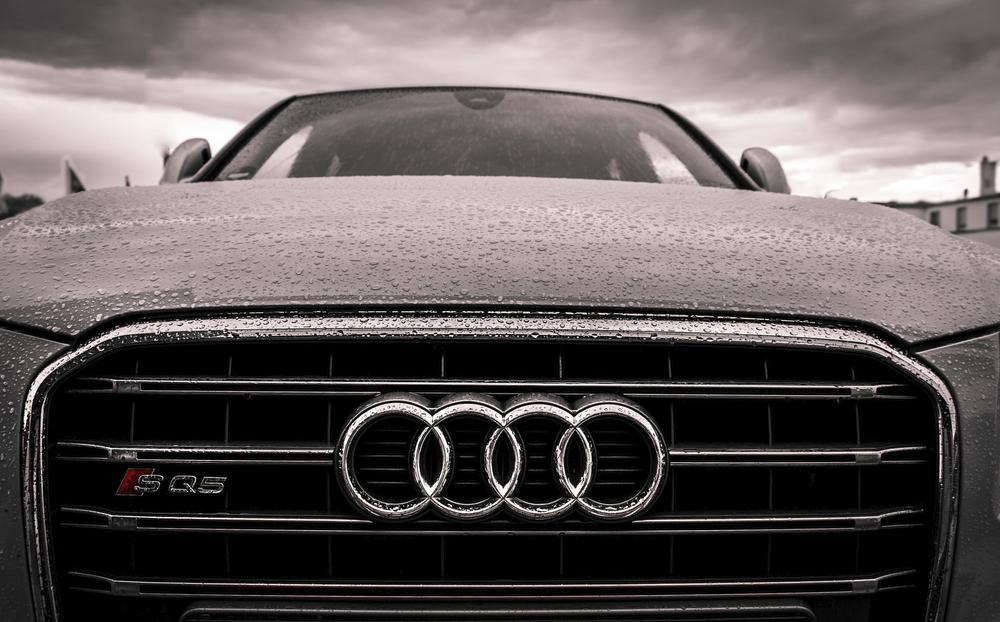 A closeup of Audi logo on car hood