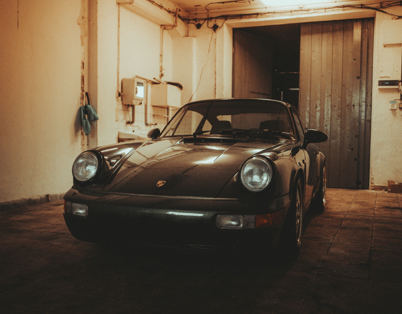 Black 1991 Porsche in a garage