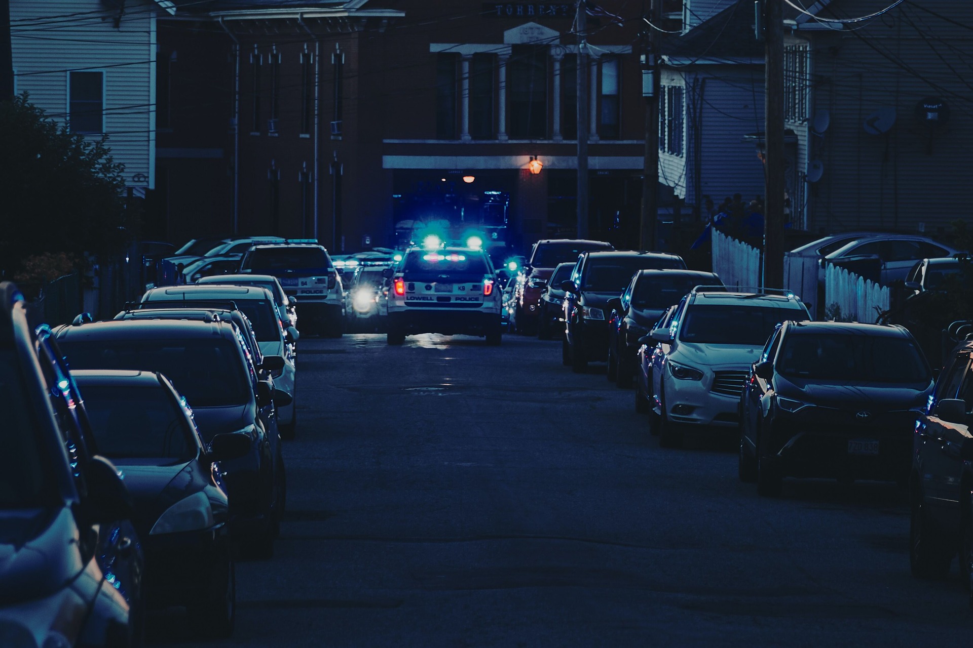 cop car on crowded suburban street