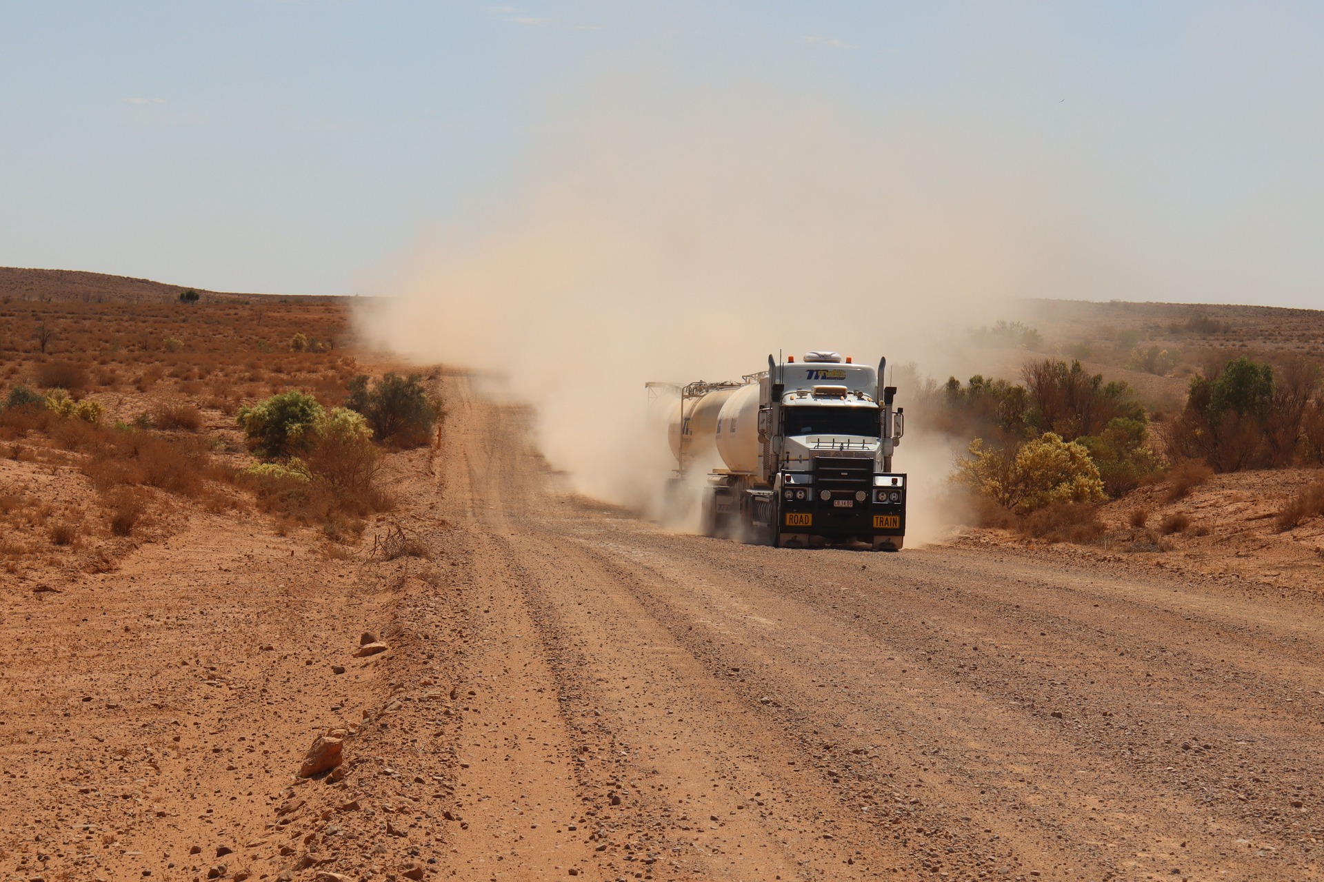 A truck hauling through the desert