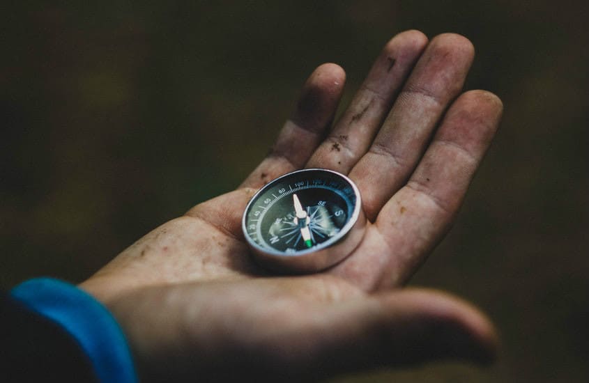 Compass in a hand.