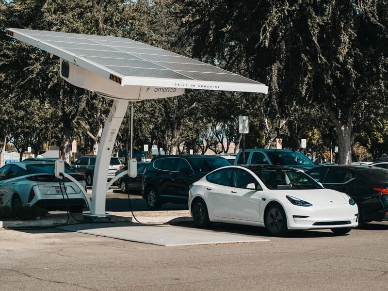 Tesla at solar charging station.