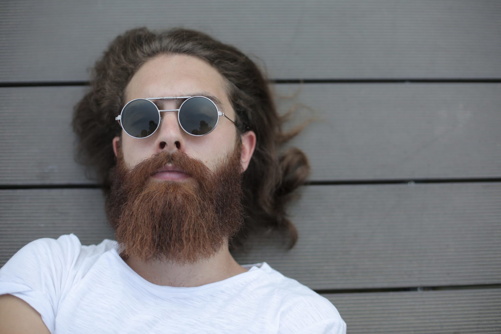 Man with mustache and beard wearing sunglasses.