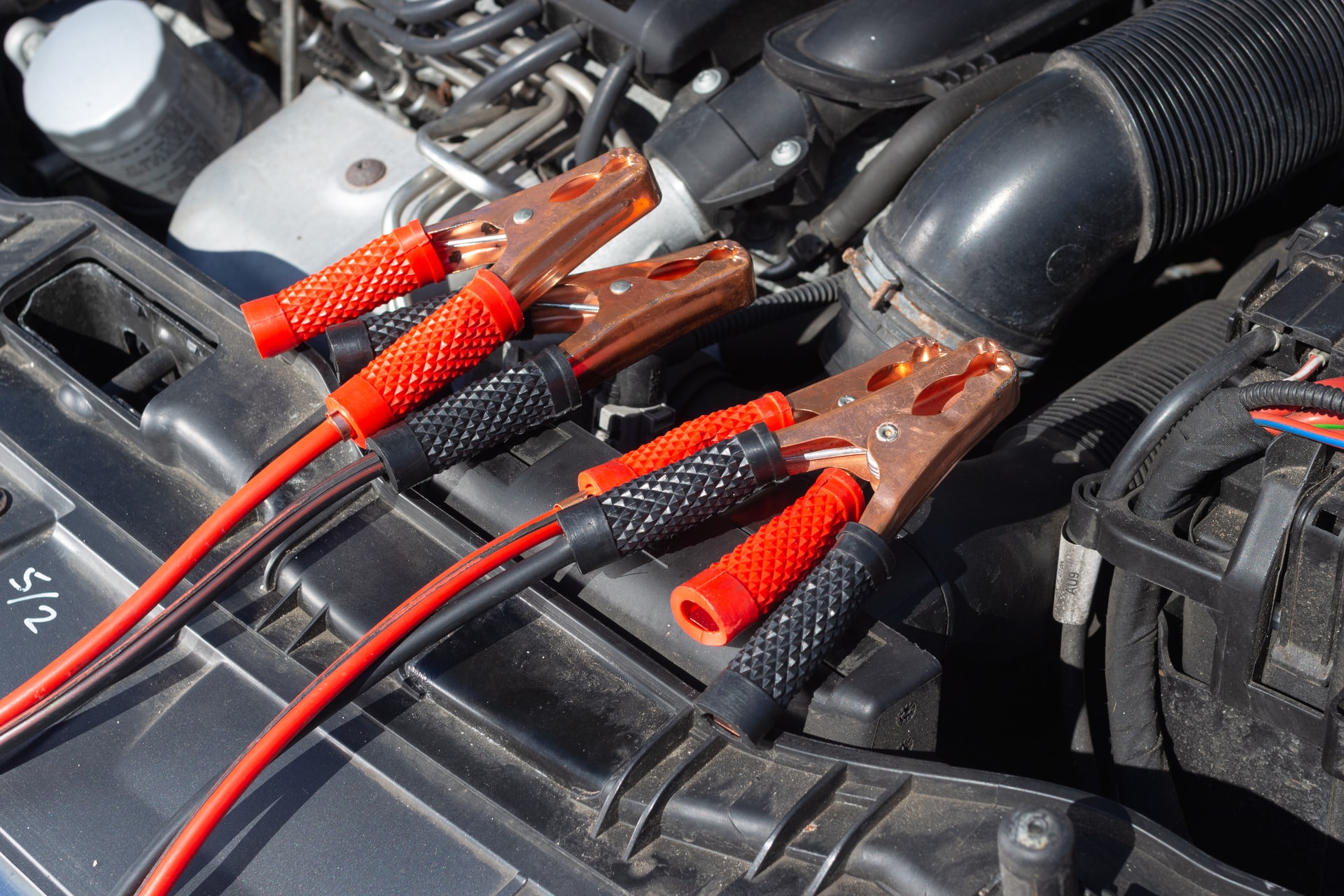 Jumper cables on car.