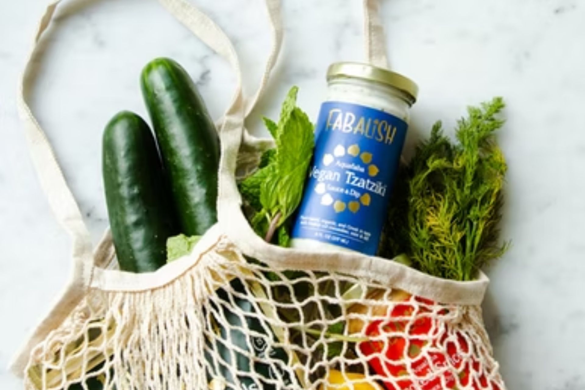 7-sustainable-living-ideas-that-will-elevate-your-life Groceries in a knit bag.
