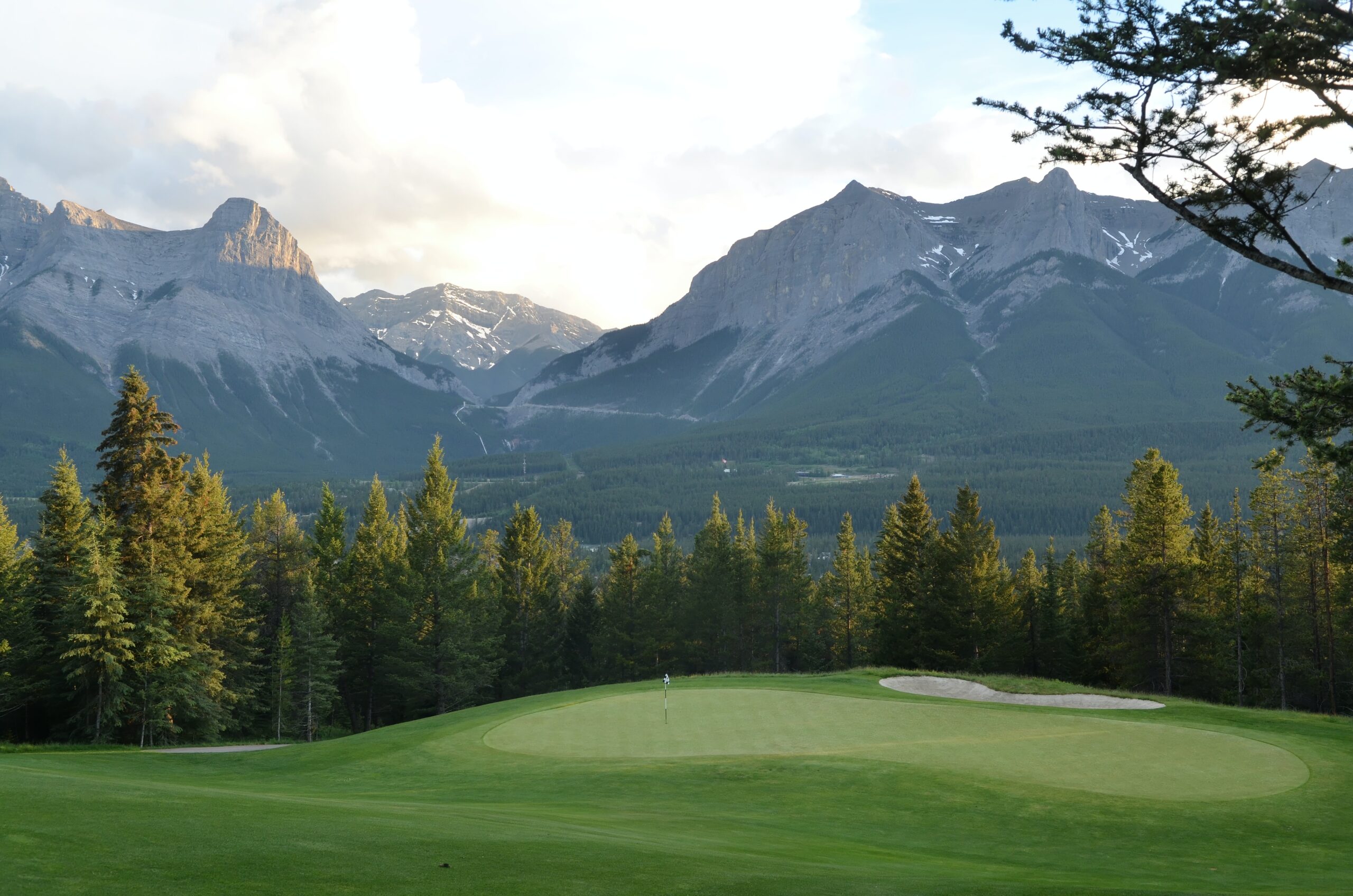 golf course with mountains