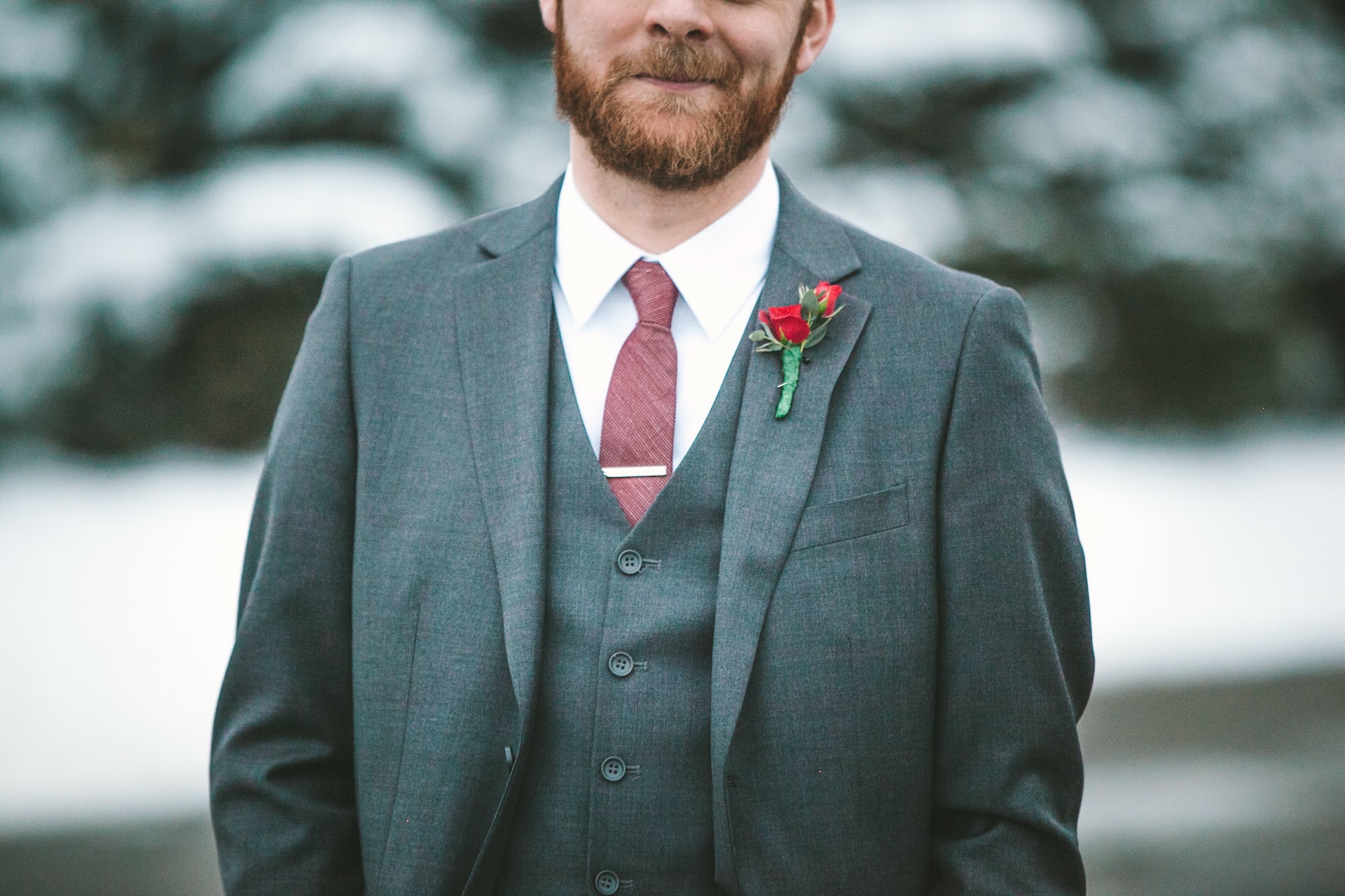 Bearded man in gray suit.