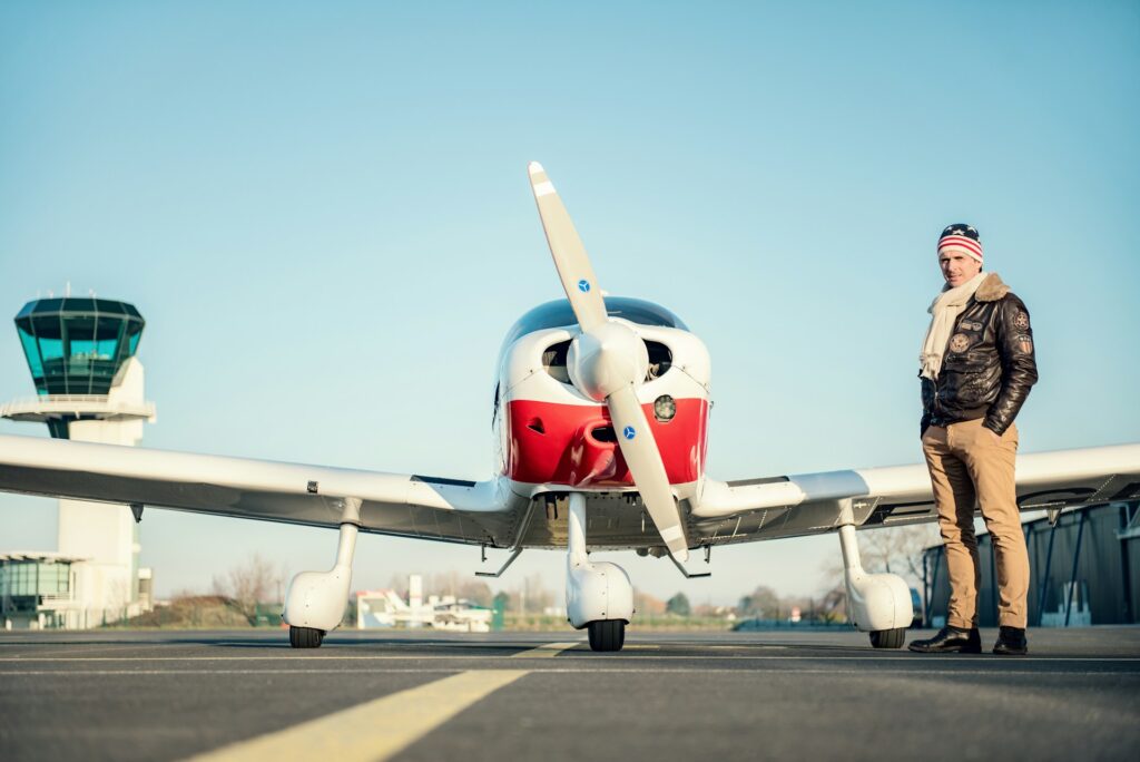 Man standing in front of plane