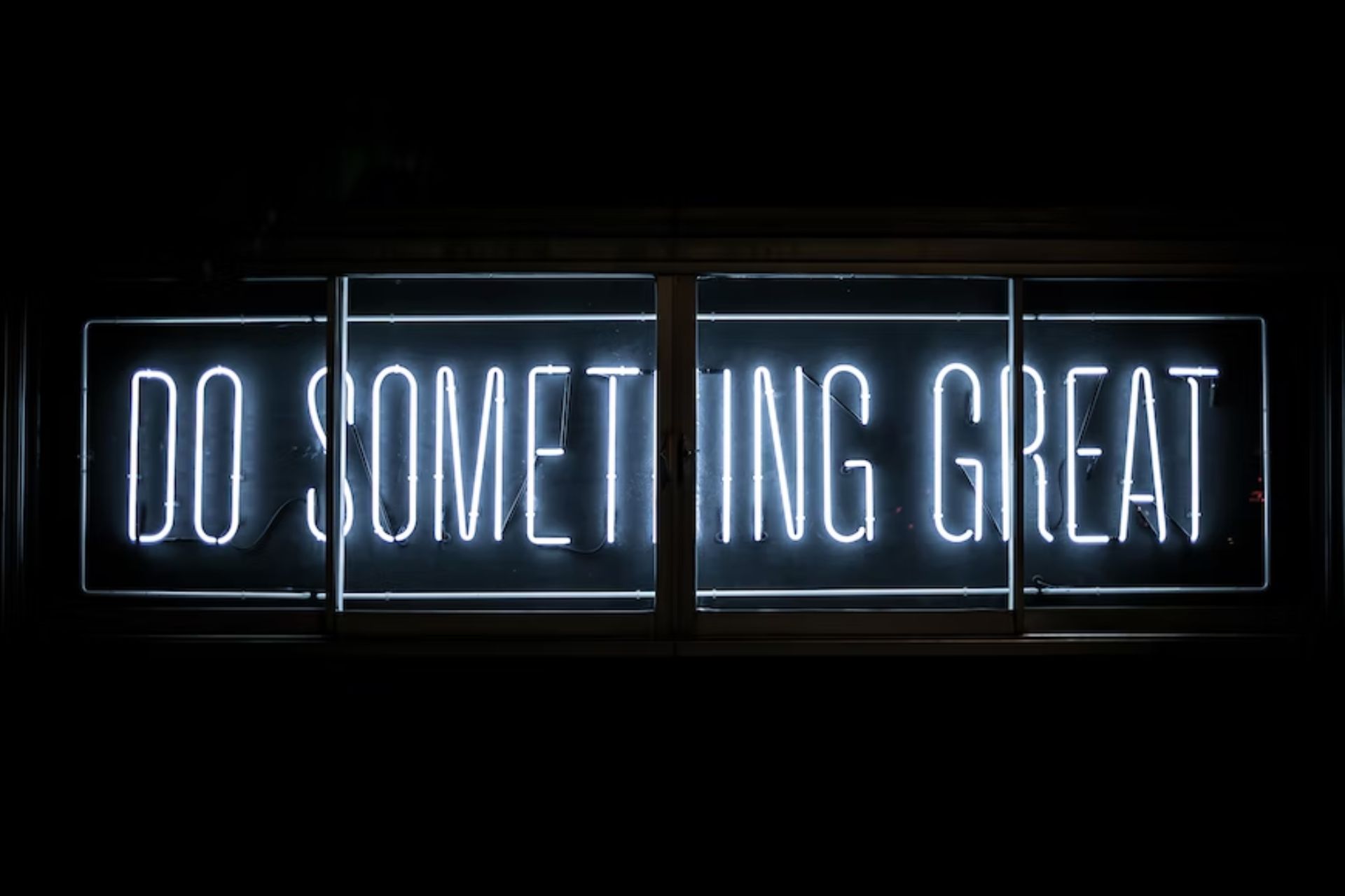 Neon sign that says, "Do Something Great."