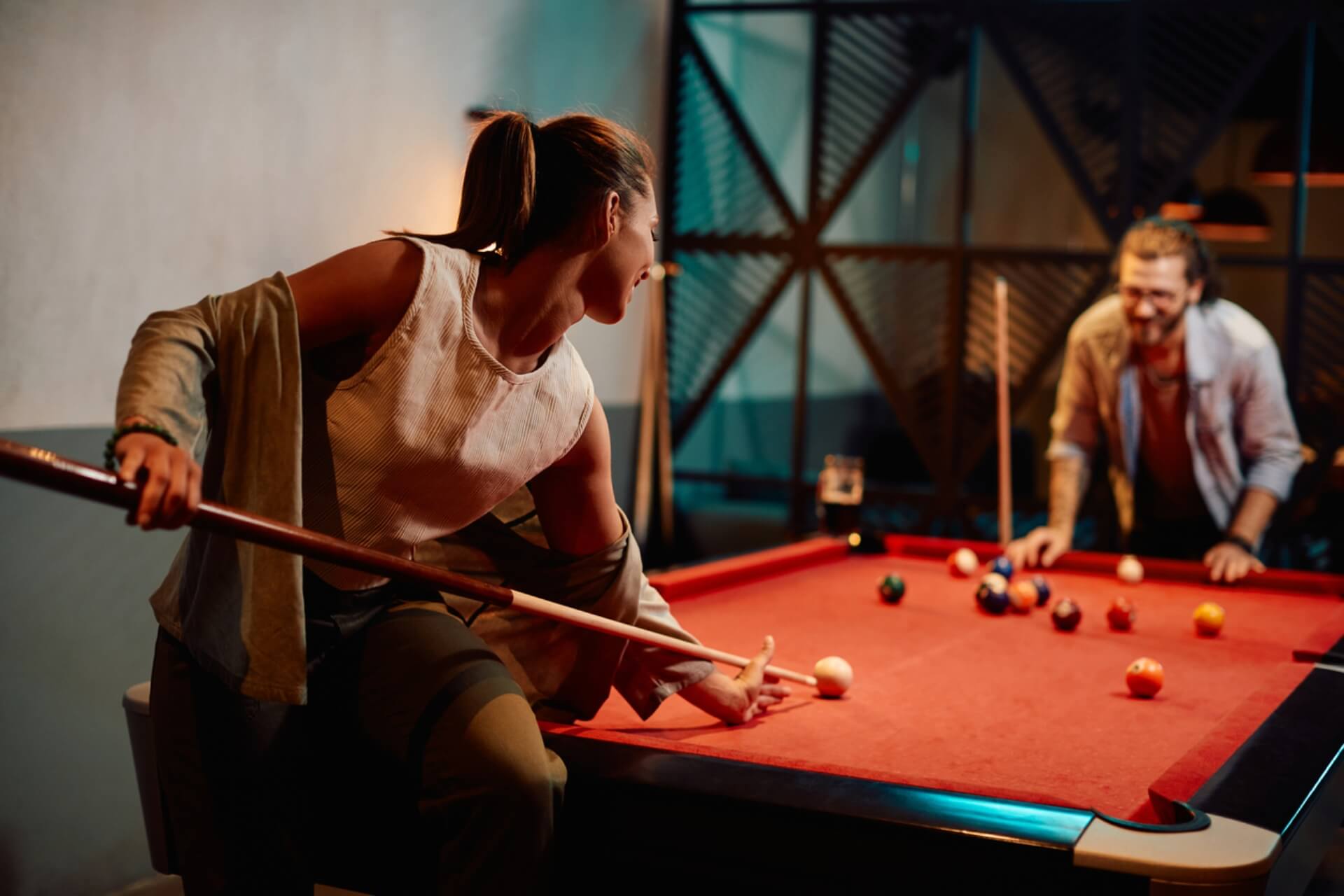 Two people playing pool.