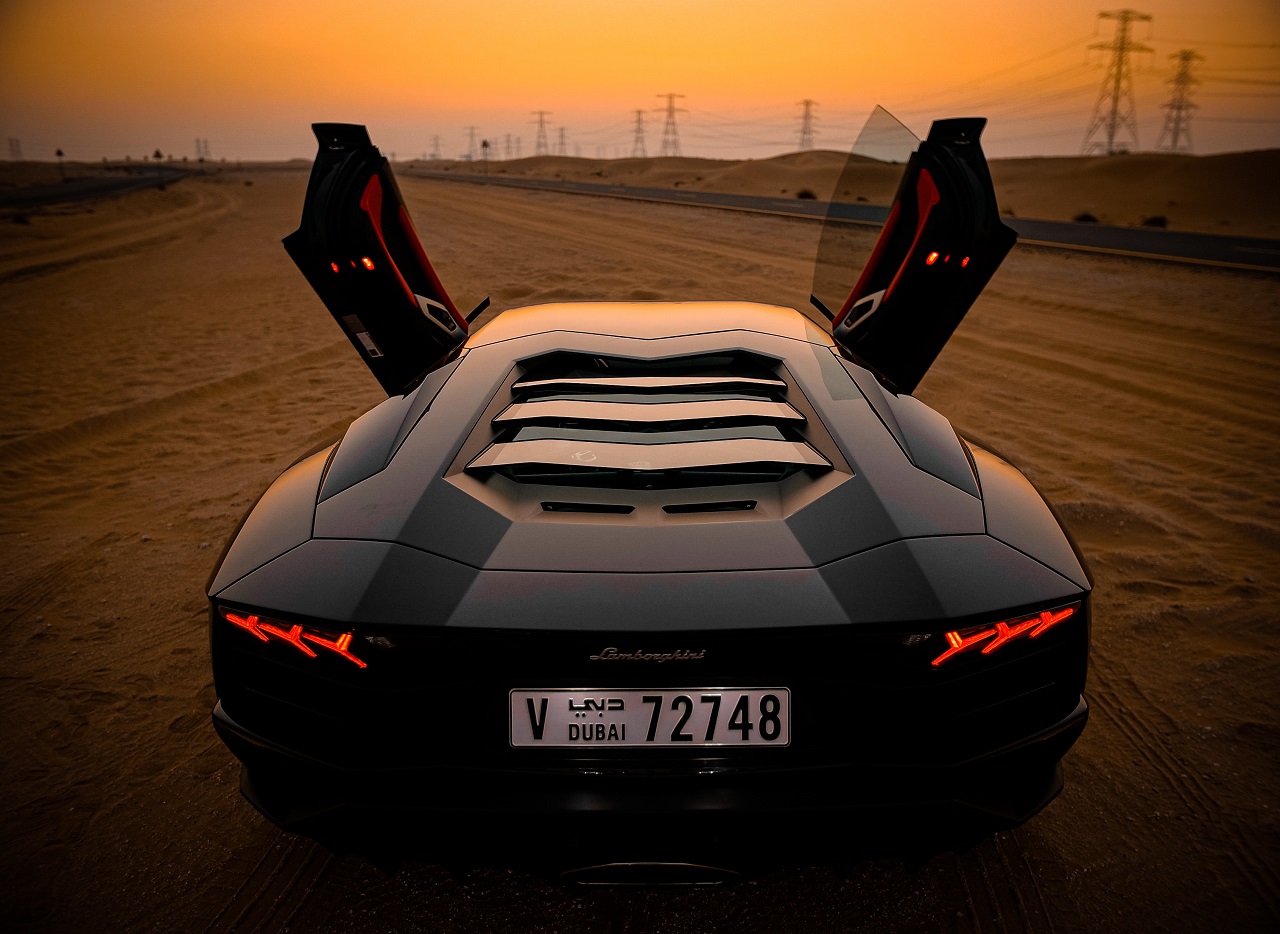 Lamborghini with doors open.