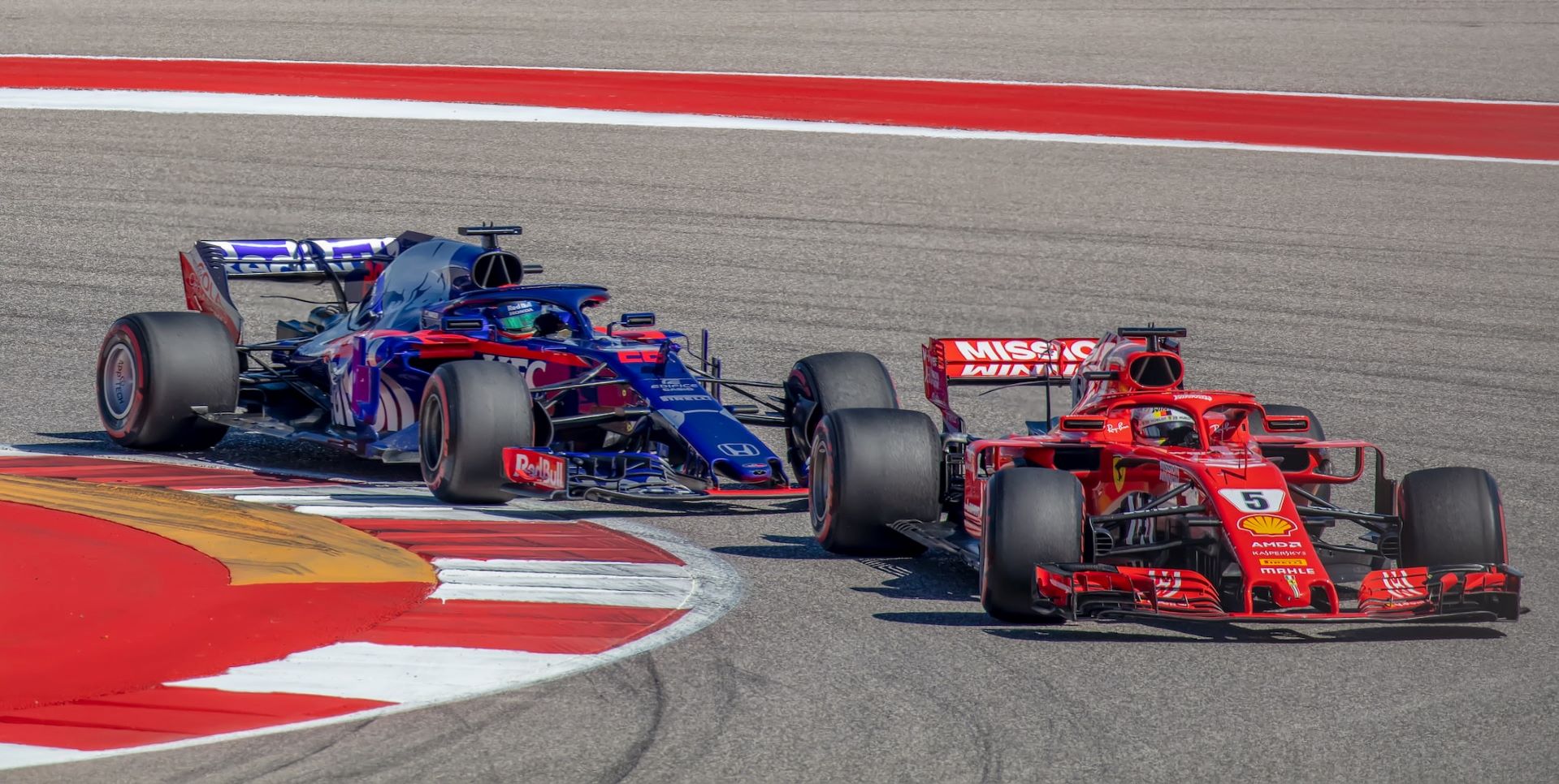 Red and blue formula 1 cars.