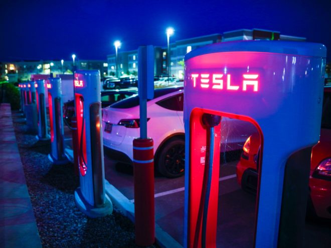 Tesla charging station at night.