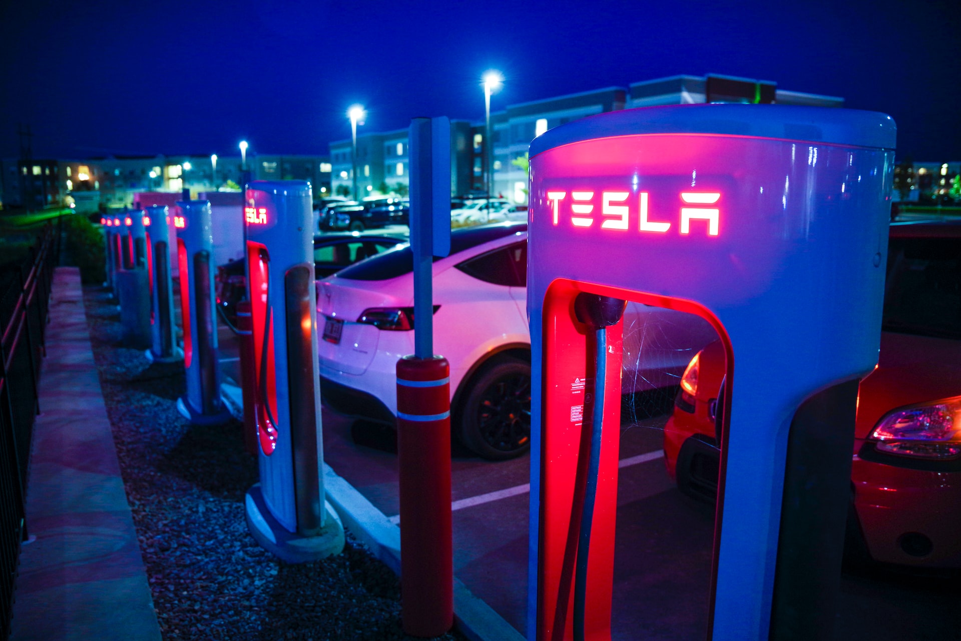 Tesla charging station at night.