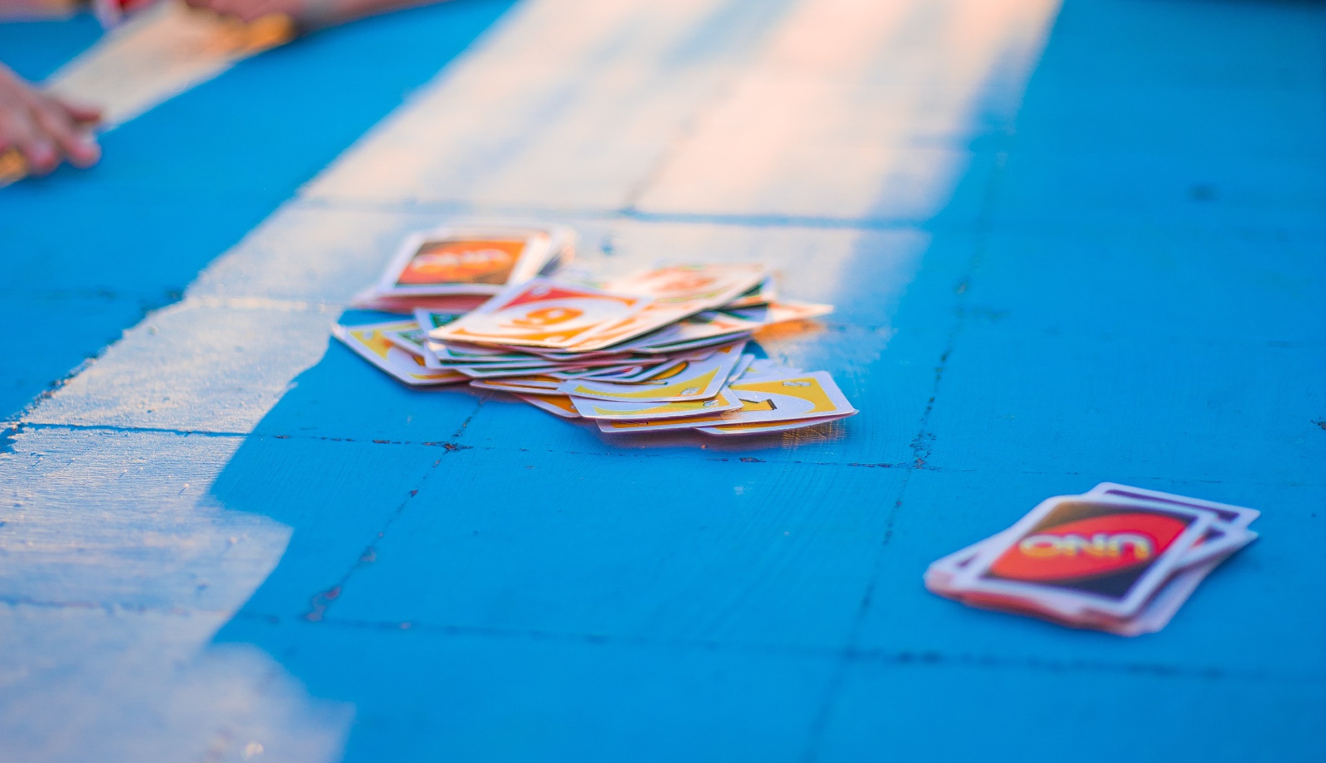 a closeup of a pile of Uno cards.