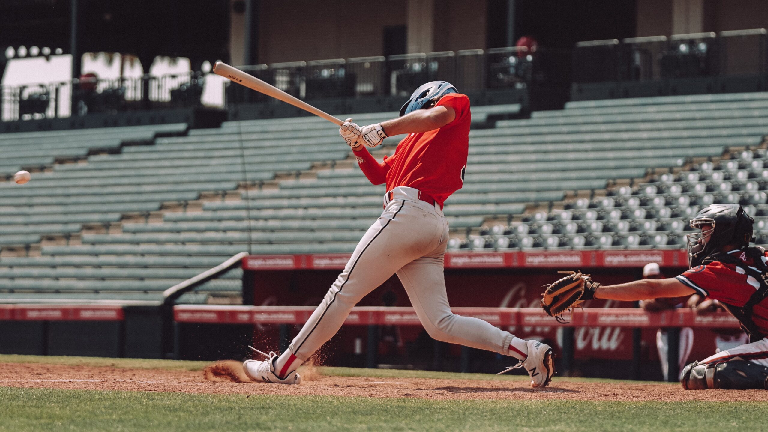 a photo of a baseball player mid-swing
