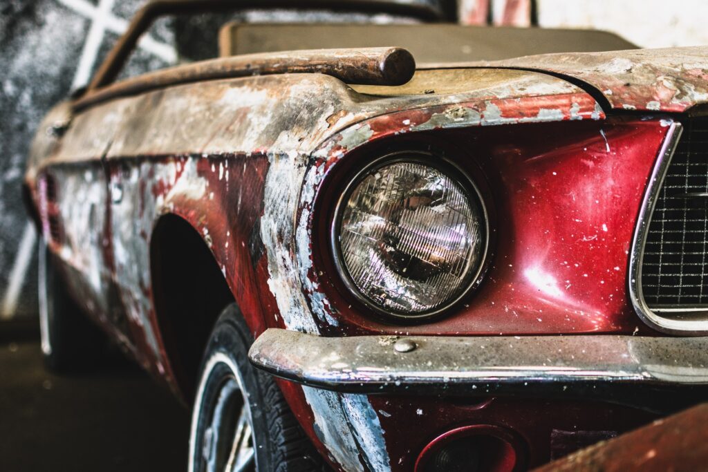 Closeup of a heavily rusted classic car