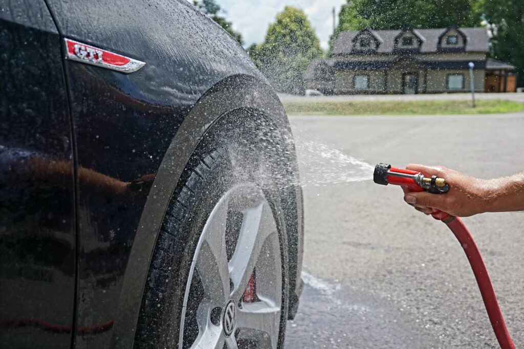 car tire being power washed