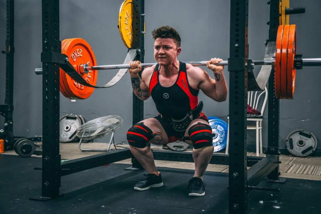 Here you can see a powerlifter wearing a belt and knee wraps while performing a heavy squat. These accessories are absolute must-haves if you want to reach maximum strength levels with minimum injury risk.