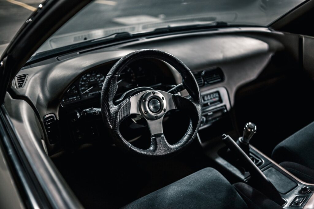 The driver's side of a manual transmission car