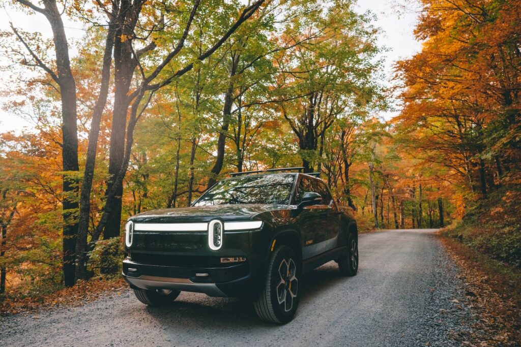 Rivian R1T electric truck driving in the Blue Ridge Mountains