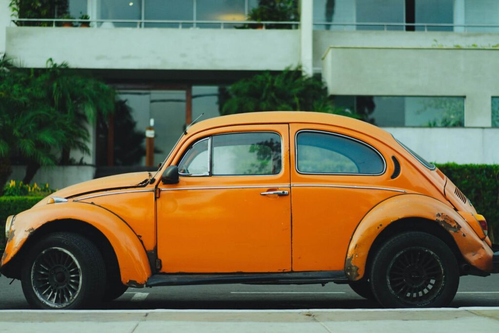 Rusty orange Volkswagen Beetle