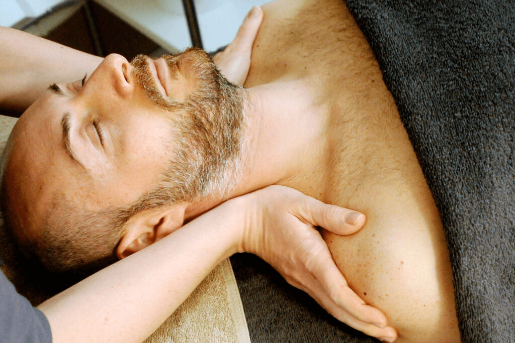 How to relieve sore muscles fast -a man getting a massage