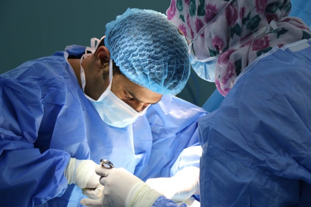 Surgeon operating on someone