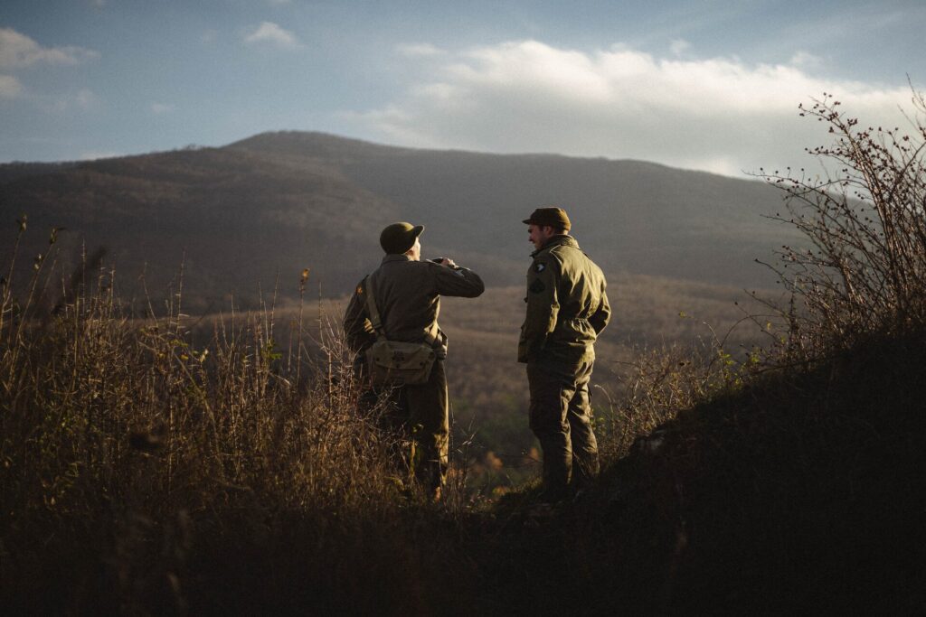 Two men talking in the field