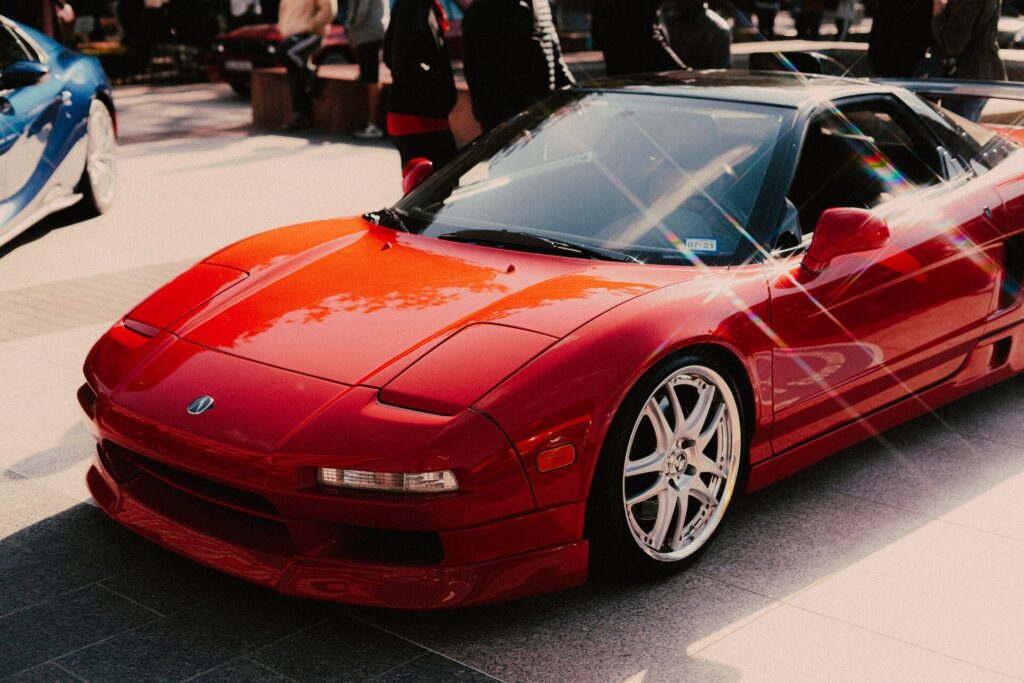 Red Acura NSX at a parking lot