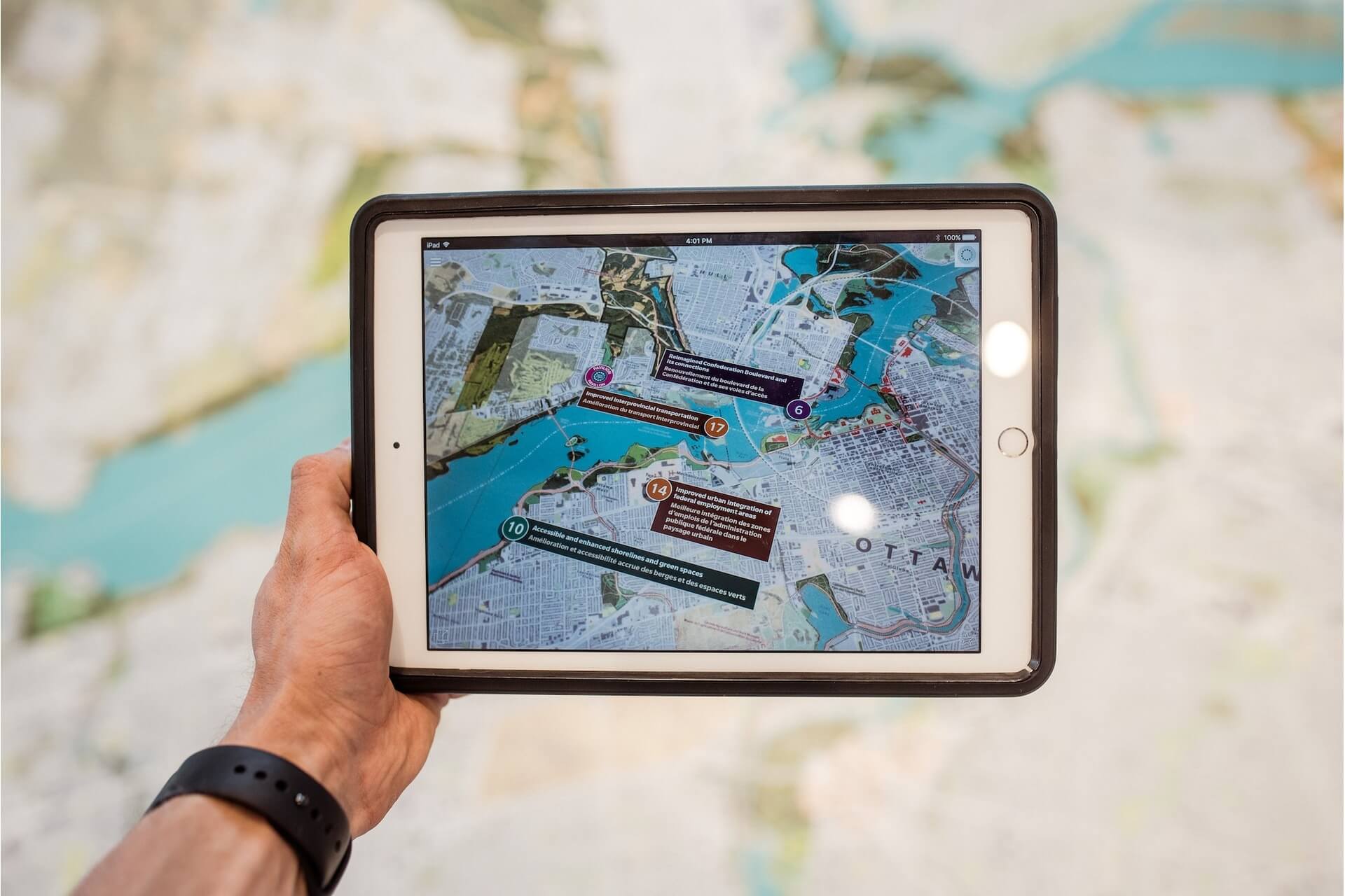 hand holding an ipad with a map