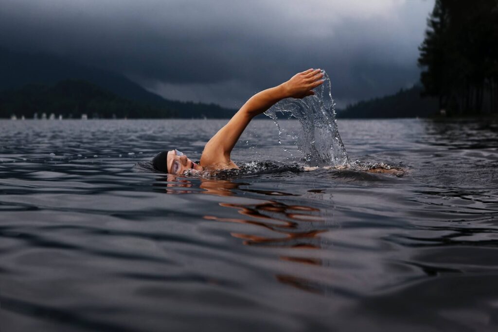 Person swimming in a lake