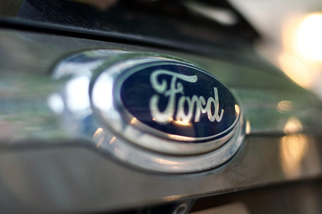 A blue and gray Ford logo on a vehicle.