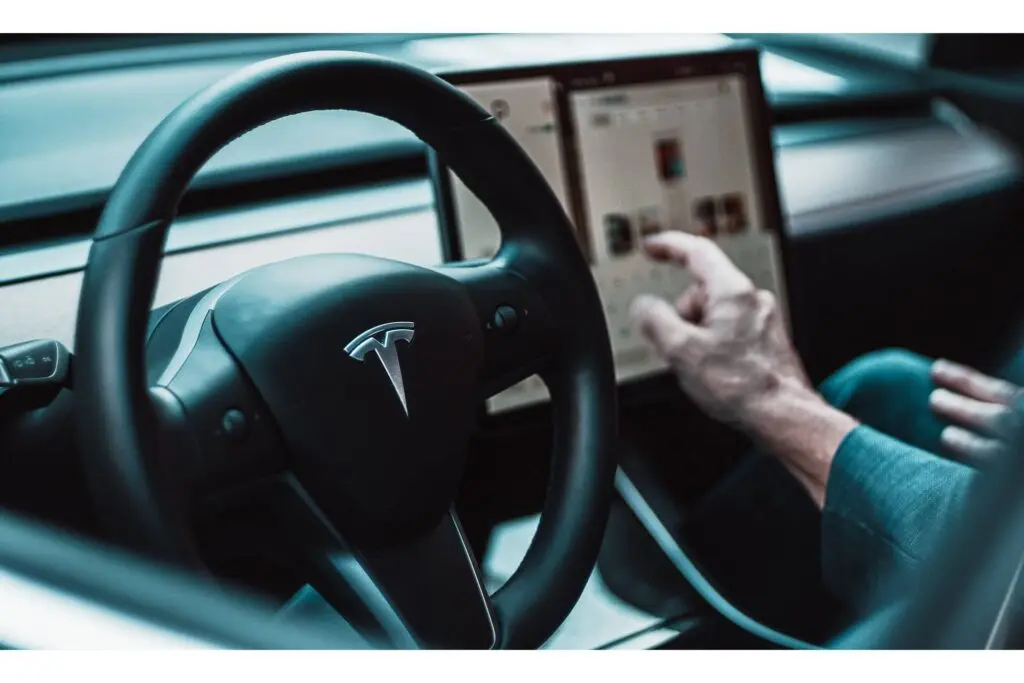 A close-up of a Tesla steering wheel