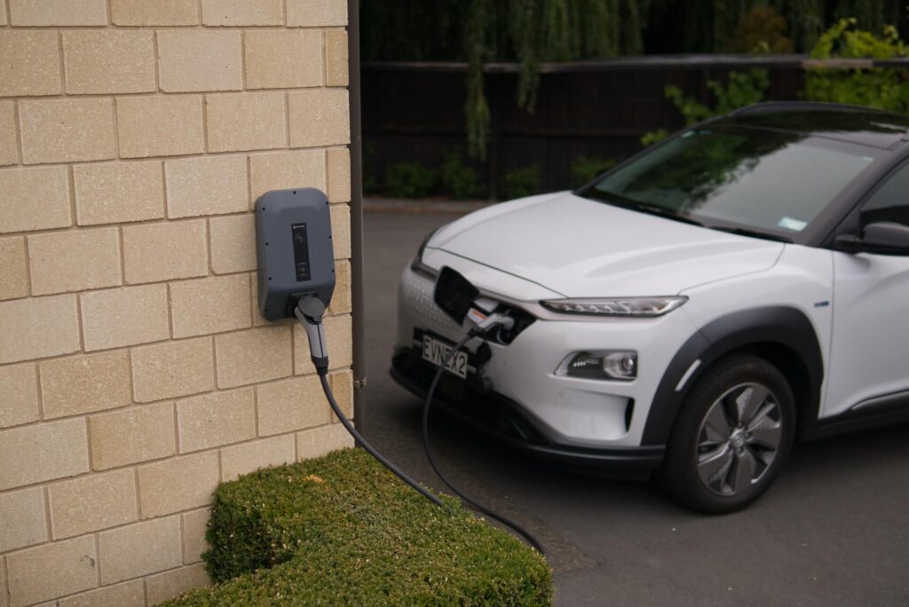 Hyundai Konda driver parks their EV at a charging station. 