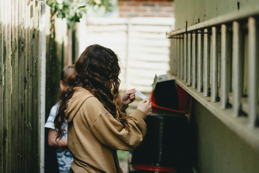 Two kids finding a geocahe